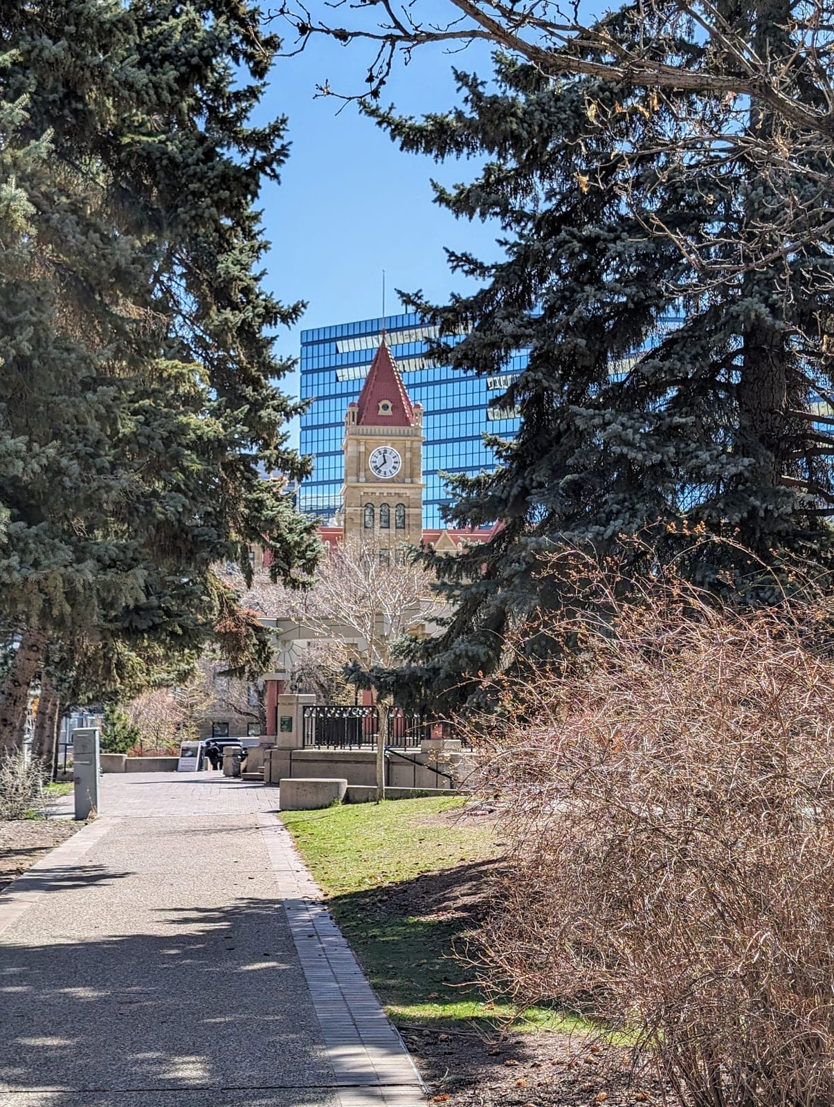 Calgary City Hall's sandstone facade beside Olympic Plaza in downtown Calgary.