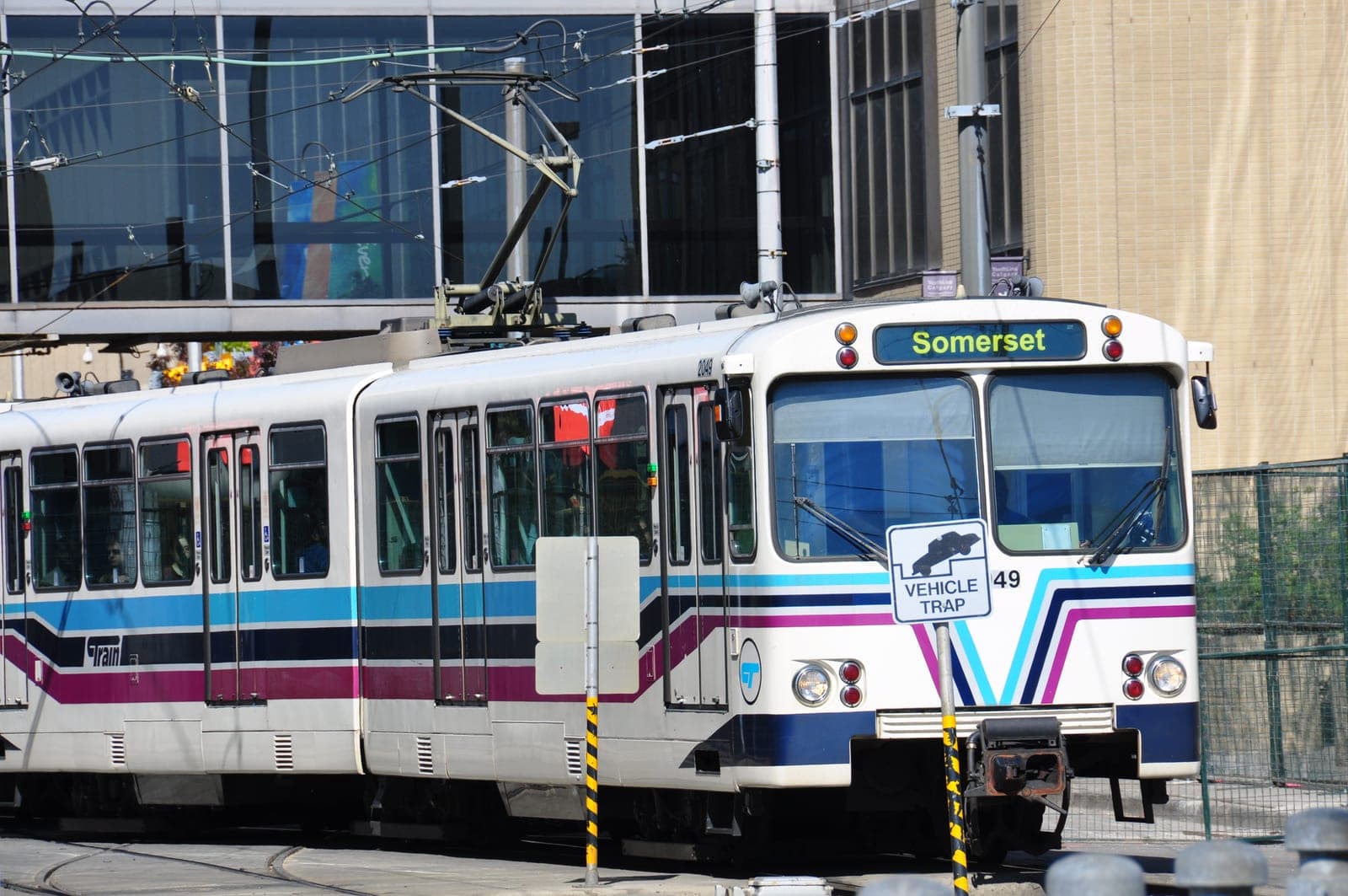 A Calgary Transit C-Train light rail vehicle at an outdoor platform.